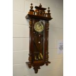 A VICTORIAN WALNUT VIENNA WALL CLOCK, 8 day movement, the circular dial with Roman numerals,