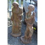 TWO CAST IRON GARDEN FIGURES OF LADIES AT HARVEST