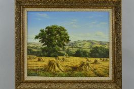 LESLEY HAMMETT (BRITISH, B.1955) 'CORN STACKS', harvest scene in hilly landscape, white washed