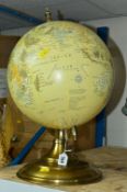 A MODERN TABLE TOP TERRESTRIAL GLOBE ON A METAL STAND