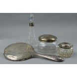A SILVER MIRROR, silver rimmed perfume bottle, two powder jars (4)