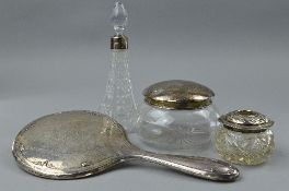 A SILVER MIRROR, silver rimmed perfume bottle, two powder jars (4)