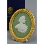 A BOXED LIMITED EDITION WEDGWOOD PORTRAIT MEDALLION, in white on sage green jasper in an ormolu