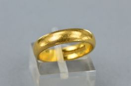 A 22CT BAND, ring size L, approximate weight 6.4 grams