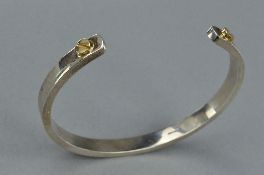 A SILVER BANGLE, approximate weight 33.8 grams