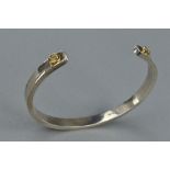 A SILVER BANGLE, approximate weight 33.8 grams