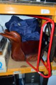 AN EVENTER BROWN LEATHER SADDLE, and a tubular metal saddle stand and two bags of tack (2)