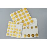 THREE CARD TRAYS CONTAINING A NUMBER OF GOLD COLOURED BRITISH ARMY UNIFORM BUTTONS, large and small,