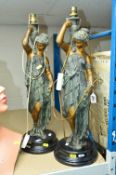 A PAIR OF PAINTED SPELTER FIGURAL TABLE LAMPS, each of a classical lady on a black glazed ceramic