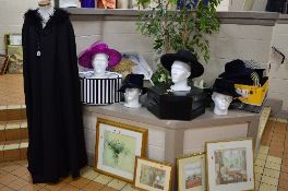 A BLACK EVENING LONG CAPE, with feather trim hood and various hats and handbags, etc
