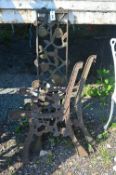 A PAIR OF CAST IRON BENCH ENDS AND MATCHING BACK PANEL (3)