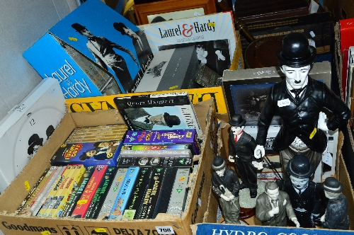 A COLLECTION OF LAUREL AND HARDY AND CHARLIE CHAPLIN FILMS, PRINTS AND FIGURINES, including boxed