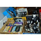A COLLECTION OF LAUREL AND HARDY AND CHARLIE CHAPLIN FILMS, PRINTS AND FIGURINES, including boxed