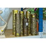 TRENCH ART - SIX SHELL CASES CONVERTED TO VASES/FIRESIDE STANDS, all embossed with foliate designs