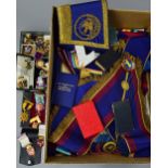 A BOX AND TRAY OF MASONIC APRONS, medals and badges, etc