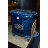 AN EARLY 20TH CENTURY FRENCH OVAL BLUE ENAMEL STOVE, with opening door to narrowest end, pierced