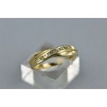 A 9CT CROSSOVER DIAMOND RING, size P, approximate weight 2.0 grams