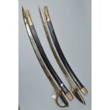 TWO MIDDLE EASTERN/ASIAN CONTINENT CURVED SWORDS, with leather and metal scabbards, both blades have