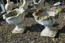 A PAIR OF COMPOSITE GARDEN URNS WITH LEAF FORM BOWL, approximate height 45cm x diameter 48cm
