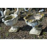 A PAIR OF COMPOSITE GARDEN URNS WITH LEAF FORM BOWL, approximate height 45cm x diameter 48cm