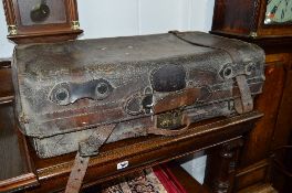 AN EARLY 20TH CENTURY BROWN LEATHER SUITCASE, marked to brass look Cheney (sd)