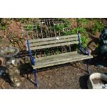 A GARDEN BENCH WITH PAINTED CAST METAL ENDS AND STRETCHER, together with a garden gate, gate