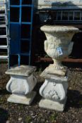 A COMPOSITE GARDEN URN, and two square columns, urns stands 49cm high