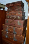 SEVEN VARIOUS GRADUATED BROWN LEATHER SUITCASES, bottom two cases marked The Revelation, together