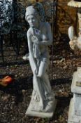 A COMPOSITE GARDEN FIGURINE OF A SEMI CLAD GRECIAN LADY, standing approximately 97cm high
