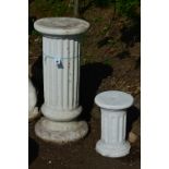 TWO COMPOSITE GARDEN COLUMNS, one 80cm high, the other 38cm high (approximately)