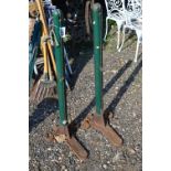 A PAIR OF B HIRST & SONS MULTUM IN-PARVO TENNIS NET SUPPORTS, green painted steel uprights, cast