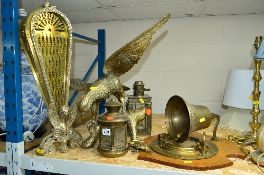 A BRASS FOLDING FAN SHAPED FIRE SCREEN, two small brass lanterns, an ornamental eagle with wings