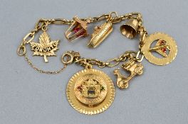 A 9CT CHARM BRACELET WITH SEVEN CHARMS, approximate size 16.5 grams