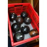 A CRATE CONTAINING EIGHT VINTAGE WOODEN BOWLS together with a copper kettle (2)