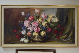 F.KORMENDY (20TH CENTURY), still life bowl of roses and other summer blooms on a ledge, oil on