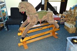 A VINTAGE WOODEN ROCKING HORSE BY P.C & R. SCHAAY OF DISS, NORFOLK, wooden framed with makers mark