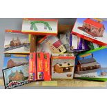 A QUANTITY OF BOXED OO GAUGE MODEL RAILWAY SCENIC ACCESSORIES, mainly building construction kits, to