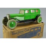 A BOXED CHAD VALLEY LITHOGRAPHED TINPLATE CLOCKWORK SALOON CAR, No.10004, green body, black