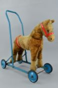 A CHILTERN TOYS RIDE ON/PUSH ALONG HORSE, c.1960's, has some wear and fur loss especially to the