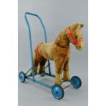 A CHILTERN TOYS RIDE ON/PUSH ALONG HORSE, c.1960's, has some wear and fur loss especially to the