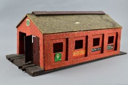 A WOODEN O GAUGE TWO ROAD ENGINE SHED, no makers markings, possibly scratch or kit built, in need of
