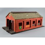 A WOODEN O GAUGE TWO ROAD ENGINE SHED, no makers markings, possibly scratch or kit built, in need of