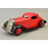 A MARX TINPLATE CLOCKWORK SALOON CAR, British made, red body and hubs, black chassis and