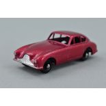 AN UNBOXED MATCHBOX ASTON MARTIN DB2-4 MK1, No.53, metallic red body with knobbly black plastic