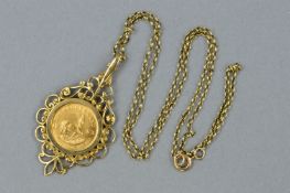 A LATE 20TH CENTURY, 1/10 KRUGERRAND GOLD PENDANT, DATED 1983, set within a fancy scroll design
