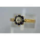 A 9CT GOLD SAPPHIRE AND DIAMOND ROUND CLUSTER RING, ring size K, approximate gross weight 1.1 grams