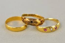 THREE GOLD RINGS, to include a 22ct band, approximate weight 2.2 grams and two 18ct rings,