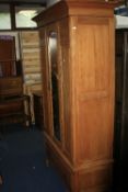 AN EDWARDIAN SATINWOOD SINGLE MIRROR DOOR WARDROBE above a single drawer