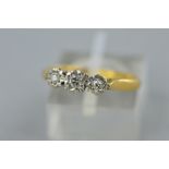 A MID TO LATE 20TH CENTURY THREE STONE DIAMOND RING, illusion set, estimated diamond weight 0.