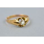 AN EARLY 20TH CENTURY SINGLE STONE DIAMOND RING, gypsy set, estimated old cut diamond weight 0.28ct,